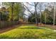 Expansive backyard with lush green lawn and mature trees offers privacy at 3220 Silver Lake Ne Dr, Brookhaven, GA 30319