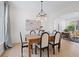 Bright dining room with a chandelier, art, and stylish chairs at 3220 Silver Lake Ne Dr, Brookhaven, GA 30319