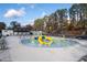 Community pool with fun water features and ample seating areas at 3220 Silver Lake Ne Dr, Brookhaven, GA 30319