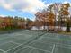 Well-maintained tennis courts surrounded by lush landscaping and trees at 3220 Silver Lake Ne Dr, Brookhaven, GA 30319