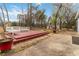 Backyard area featuring a wood deck with a bench, perfect for relaxing outdoors at 4555 Cedar Heights Ct, Stone Mountain, GA 30083