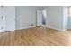 Bedroom featuring wood-look floors, two closets, and two windows with natural light at 4555 Cedar Heights Ct, Stone Mountain, GA 30083