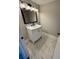 Bathroom with marble tile flooring, marble vanity top, and dark accents at 4809 Thompson Mill Rd, Lithonia, GA 30058