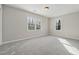 Empty bedroom with carpet, natural light, and neutral paint at 4809 Thompson Mill Rd, Lithonia, GA 30058