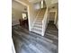 Inviting foyer featuring modern flooring, a staircase to the upper level, and neutral paint at 4809 Thompson Mill Rd, Lithonia, GA 30058