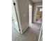 Hallway featuring neutral walls and carpet, with views of the rooms at 4809 Thompson Mill Rd, Lithonia, GA 30058