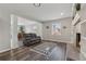 Living room with grey wood flooring, decorative rug, and fireplace at 4809 Thompson Mill Rd, Lithonia, GA 30058