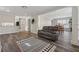 Open floor plan boasts living room with wood flooring and access to dining room at 4809 Thompson Mill Rd, Lithonia, GA 30058