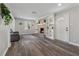 Bright living room features a fireplace, built-in shelving, and wood flooring at 4809 Thompson Mill Rd, Lithonia, GA 30058