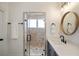 Bathroom featuring glass shower door, towel racks, and white countertop sink at 625 Glenwood Se Pl, Atlanta, GA 30316