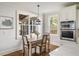 Cozy dining area featuring a table with chairs and a view to the porch and exterior at 625 Glenwood Se Pl, Atlanta, GA 30316