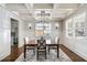 Dining room features coffered ceilings, wainscoting, chandelier, and natural light at 625 Glenwood Se Pl, Atlanta, GA 30316