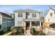 Charming two-story home featuring a welcoming front porch, a well-manicured lawn, and beautiful landscaping at 625 Glenwood Se Pl, Atlanta, GA 30316