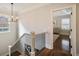 Upstairs hallway with hardwood floors and stairs leading to the bedrooms at 625 Glenwood Se Pl, Atlanta, GA 30316