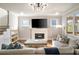 Inviting living room with a fireplace, built-in shelving, and natural light from the exterior windows at 625 Glenwood Se Pl, Atlanta, GA 30316