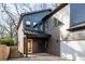 Modern home showcasing a unique design with a vibrant yellow door and a seamlessly attached two car garage at 1103 Boulevard Se Dr, Atlanta, GA 30317