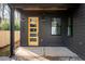 Covered porch with a yellow door and black accents at 1103 Boulevard Se Dr, Atlanta, GA 30317