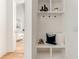 Bright hallway featuring a built-in storage bench and shelving unit, enhancing organization and style at 1103 Boulevard Se Dr, Atlanta, GA 30317