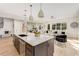 Open kitchen with a center island and breakfast bar overlooking the living area at 1103 Boulevard Se Dr, Atlanta, GA 30317