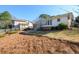 Expansive backyard featuring a sunroom addition and lush, green surroundings perfect for outdoor enjoyment at 1654 Deerfield Cir, Decatur, GA 30033