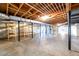 Large unfinished basement with wooden ceiling supports, concrete floor, and plumbing at 1654 Deerfield Cir, Decatur, GA 30033