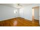 Simple bedroom featuring hardwood floors, a ceiling fan, closet, and white walls at 1654 Deerfield Cir, Decatur, GA 30033