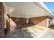 Attached brick carport with direct entry to the home, blending functionality with classic architectural style at 1654 Deerfield Cir, Decatur, GA 30033