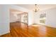 Elegant dining area with hardwood floors, chandelier lighting, and views of the outdoors at 1654 Deerfield Cir, Decatur, GA 30033