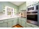 Cozy kitchen with painted cabinets, stainless steel appliances, and ample counter space at 1654 Deerfield Cir, Decatur, GA 30033