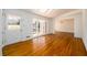 Bright living room features hardwood floors, white trim, and an open doorway to the dining room at 1654 Deerfield Cir, Decatur, GA 30033