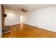 Cozy living room showcasing a brick fireplace, hardwood floors, and white paneled walls at 1654 Deerfield Cir, Decatur, GA 30033