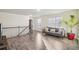 Bright open living space with modern gray couch, wood flooring, and plenty of natural light at 426 Mulberry Se Row, Atlanta, GA 30354