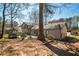 Spacious backyard with mature trees, gazebo, and partially fenced yard at 700 Hill Meadow Dr, Dacula, GA 30019