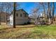 Wide backyard view with a well-maintained lawn and a charming gazebo at 700 Hill Meadow Dr, Dacula, GA 30019