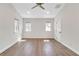 Bedroom with wood flooring, two windows, and base trim at 700 Hill Meadow Dr, Dacula, GA 30019