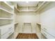 Walk-in closet featuring shelving, drawers, and hanging rods at 700 Hill Meadow Dr, Dacula, GA 30019