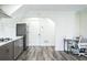 Kitchen features stainless steel refrigerator, white tile backsplash, and modern cabinets and countertops at 700 Hill Meadow Dr, Dacula, GA 30019