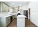 Modern kitchen with gray cabinets, marble countertops, and stainless steel appliances at 700 Hill Meadow Dr, Dacula, GA 30019