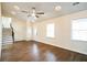 Bright living room features hardwood floors, a ceiling fan, and recessed lighting at 700 Hill Meadow Dr, Dacula, GA 30019