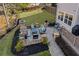 Aerial view of the backyard featuring an outdoor stone fireplace and a patio with seating at 718 Park Haven Ln, Canton, GA 30115