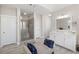 Modern bathroom featuring a glass shower, double vanity, and neutral color scheme at 718 Park Haven Ln, Canton, GA 30115