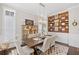 Elegant dining room featuring decorative wood wall, stylish chairs, and modern chandelier at 718 Park Haven Ln, Canton, GA 30115