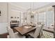 Bright dining room featuring hardwood floors, stylish decor, and comfortable seating with natural light at 718 Park Haven Ln, Canton, GA 30115