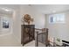 Upstairs hallway with staircase and glass cabinet for decor at 718 Park Haven Ln, Canton, GA 30115