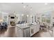 Open concept kitchen with granite counters that flows into living room with a fireplace at 718 Park Haven Ln, Canton, GA 30115