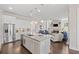 Beautiful kitchen with stainless steel appliances and an island that flows into the living area at 718 Park Haven Ln, Canton, GA 30115