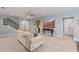 This well lit living room offers neutral walls, light carpet, and access to a staircase at 718 Park Haven Ln, Canton, GA 30115