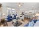 Spacious living room with a view of the modern kitchen, backyard, and natural light at 718 Park Haven Ln, Canton, GA 30115