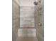 Tiled walk-in shower with a built-in bench and sleek fixtures at 718 Park Haven Ln, Canton, GA 30115