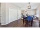 Bright kitchen flows to the living area and features a table with blue seating at 2311 Fall Creek Lndg, Loganville, GA 30052